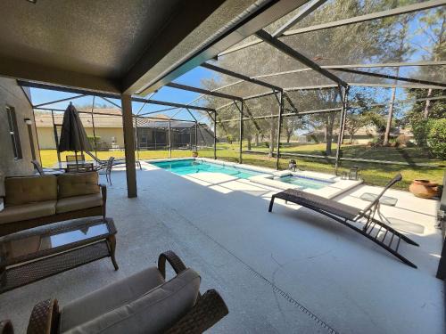 Calabria House | Amazing 5BD/5BA House with Pool and TV Near Disney