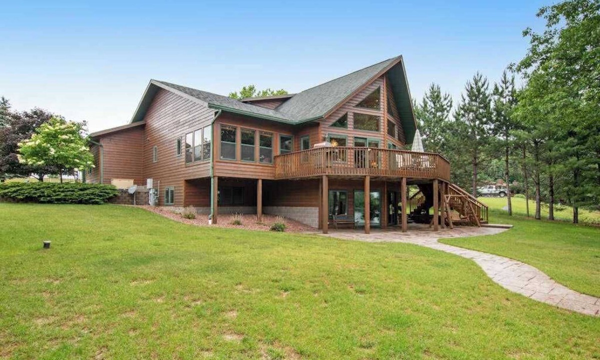 Eagle River House | Dog-friendly lakefront getaway with dock, firepit, wet bar, game room, & AC