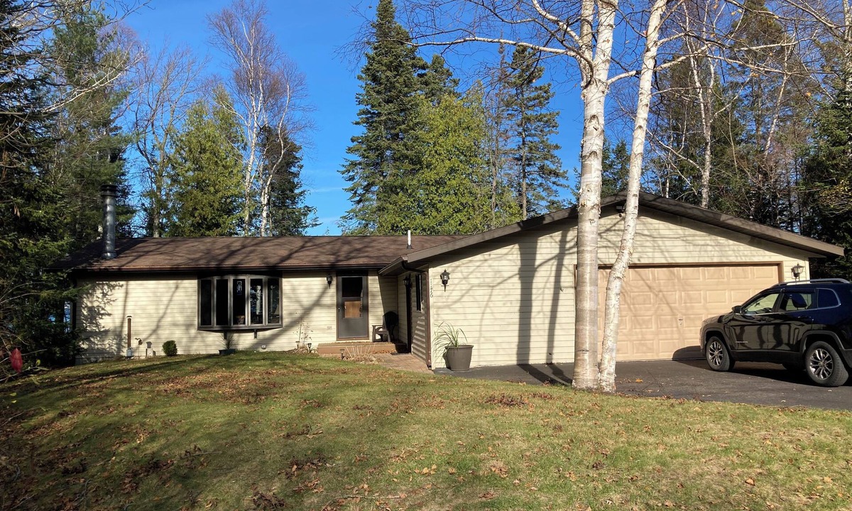 Cheboygan House | Home on Lake Huron with sandy beach and beautiful yards in Cheboygan, Michigan