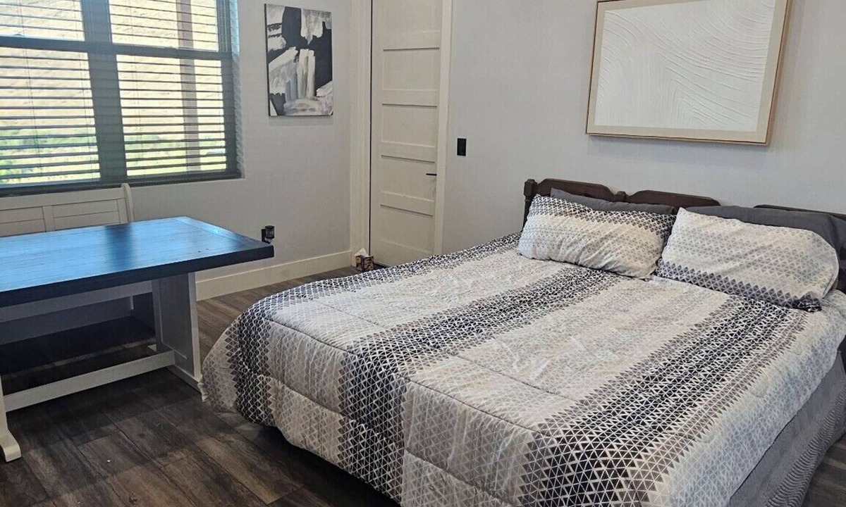 Duncan Apartment | Serene large bedroom with private entrance, bathroom, and thermostat.