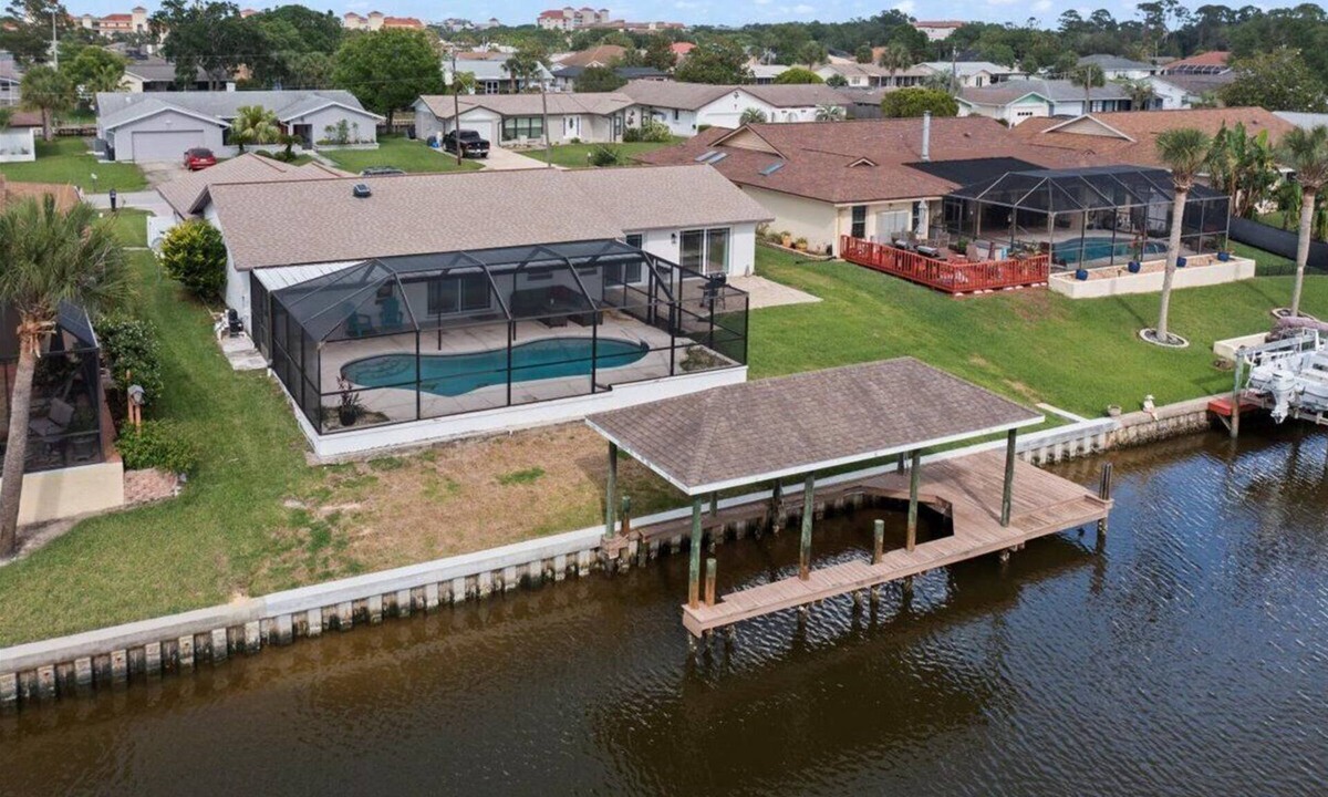 Palm Harbor House | Waterfront Retreat with Pool BBQ and Canal Views