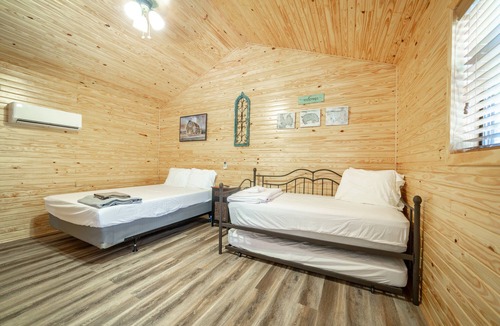 Ramer RV Rental | 1bd rm, 1 bth, hotel style cabin w/Mini fridge, micro, & tv, at Kick Back Ranch