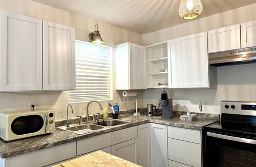 Ocean Springs House | 2BR/2BA secluded spot near water with fenced yard - Under the Oaks