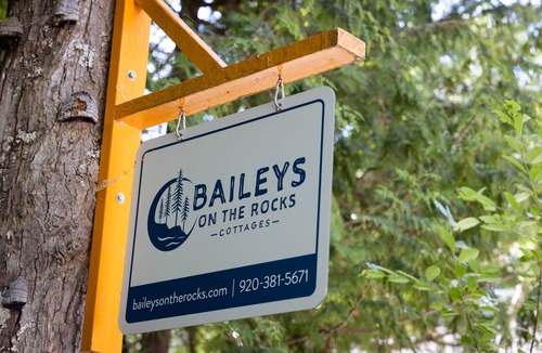 Baileys Harbor House | Arbor Cottage , Charming Wooded Cottage Minutes from Downtown