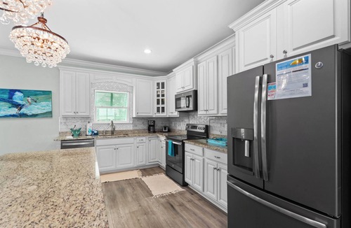 Pass Chateau Harbor House | Bayfront home with excellent view of the D.I. Bridge