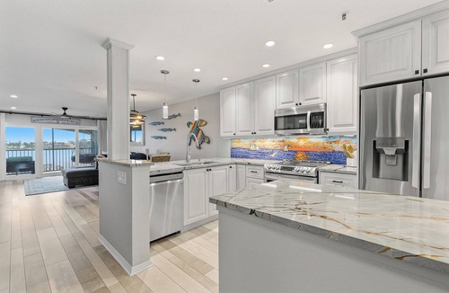 Bouchelles Island Condo | 🚲 Bouchelle Island 202 | Intracoastal Views | Screened Porch & Beach Cruisers