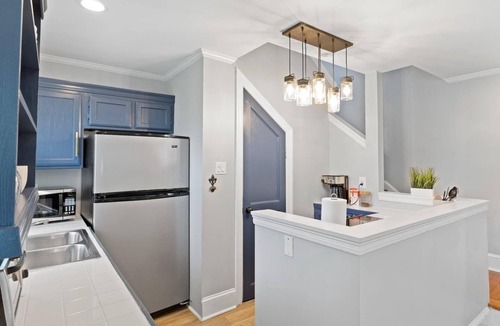 Lower Garden District Condo | Bright 1BR/2BA Garden District condo with wrap balcony, gated parking, pet-friendly, steps to Magazine