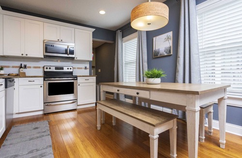 Lincolnville House | Charming Bungalow with Golf Cart Access & Hot Tub, Steps from Heart of the City!