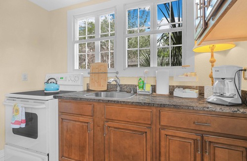 Polk City Cottage | Charming Historic Cottage with Cozy Porch and Garden Retreat