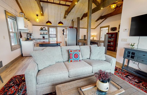 Arbor Vitae Cabin | Charming lakefront cabin with fireplace, cozy interior, streaming, & partial AC