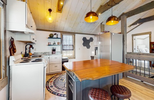 Arbor Vitae Cabin | Charming lakefront cabin with fireplace, cozy interior, streaming, & partial AC