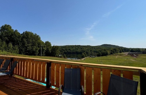 Upson Ski Chalet | Charming, ski-in, ski-out, lake-view chalet w/10 bedrooms, kitchen and AC.