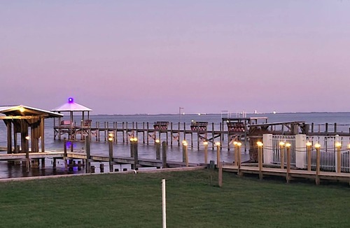 Indian River Residence House | Cozy Getaway with a Dock Facing Rocket Launch Facilities Across the Indian River