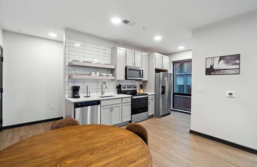 Lockerbie Square Apartment | CozySuites Mass with lounge and roof deck #37