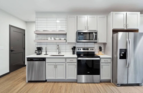 Lockerbie Square Apartment | CozySuites Mass with lounge and roof deck #37