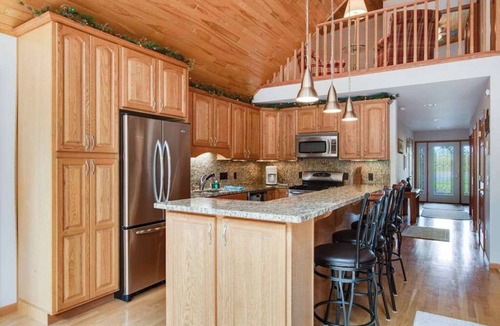 Eagle River House | Dog-friendly lakefront getaway with dock, firepit, wet bar, game room, & AC