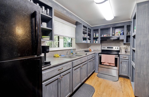 Lake City House | Downtown three bedroom house with game room and outside lounge area.