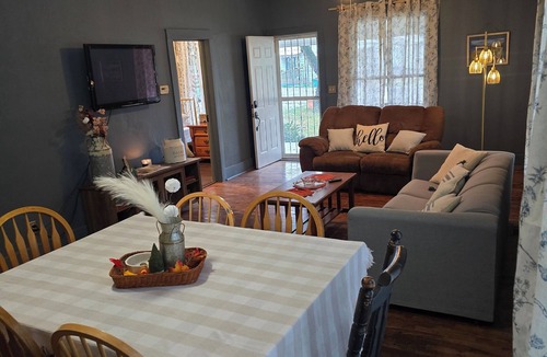 Herington House | Enchanted Cottage, located in Herington, KS with 1.5 bedrooms and a shaded yard