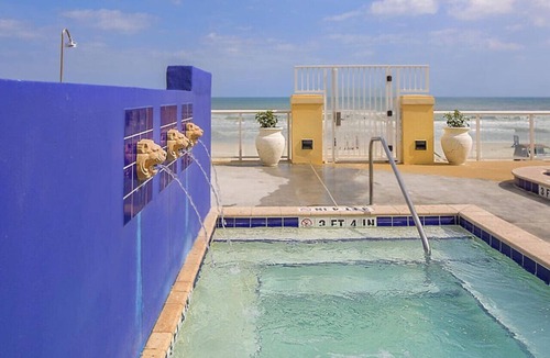 Ormond Shores Condo | Enjoy the sands of the Atlantic in this tropical 2BD condo with resort amenities for family