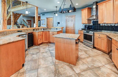Mauston House | Experience luxurious lakeside living in our 5-bed, 5-bath retreat!