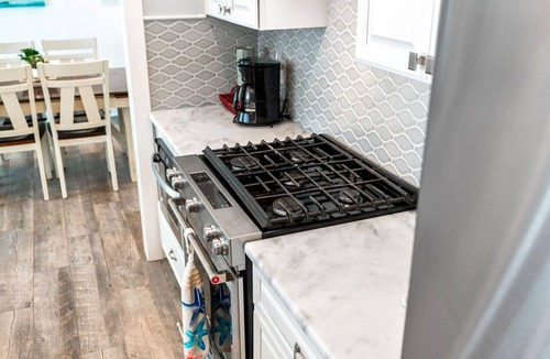 Venetian Way House | Gorgeous Beach House W/Large Outdoor Patio, Heated Pool & Gas Fire Pit!