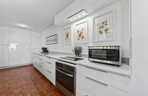 Seawinds Condo Condo | Ground floor direct oceanfront 2/2 with a balcony, heated pool, and garage parking