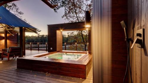 Mid America Other | Hot Springs Getaway: Fully Equipped Tented Cabin with Nature's Embrace and Private Hot Tub