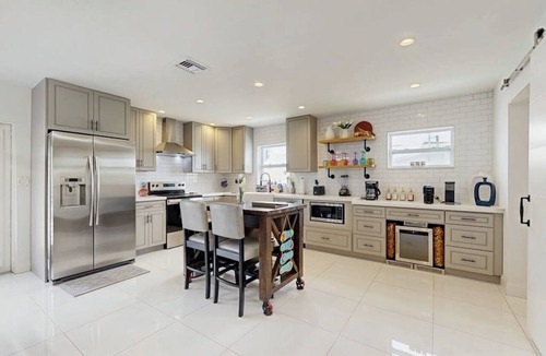 Coral Heights House | Inviting villa with heated saltwater pool & tropical backyard oasis