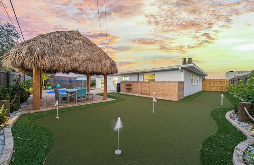 Surfside Estates House | Island Oasis with Heated Pool, Putt Putt Course, Tiki Bar, and Beach Gear!