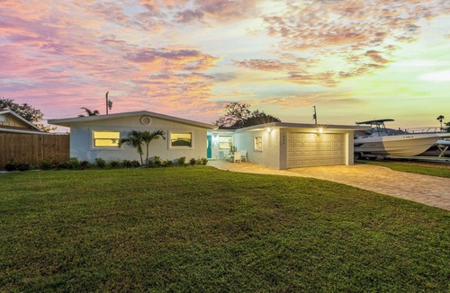 Surfside Estates House | Island Oasis with Heated Pool, Putt Putt Course, Tiki Bar, and Beach Gear!