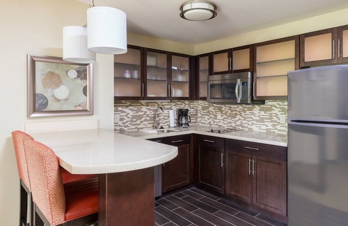 North Canton Condo | King Suite. Free Breakfast Buffet. Pool & Hot Tub Access.