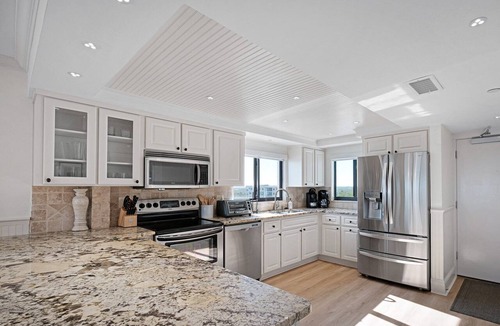 New Smyrna Beach Condo | Luxury, direct oceanfront 2/2, top-floor corner with wrap-around balcony and heated pool