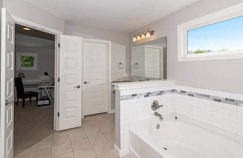Maxwell House | Master bedroom with lake view Fishers