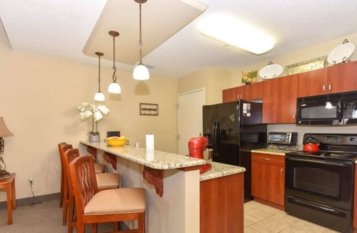 National Gardens Condo | NEW! Harley Retreat Near Beach, Onsite Pool, WiFi!