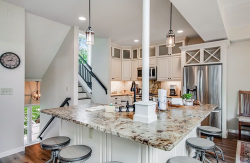 Eagle River Condo | Newly-built condo on Duck Lake with decks, private dock, & firepit