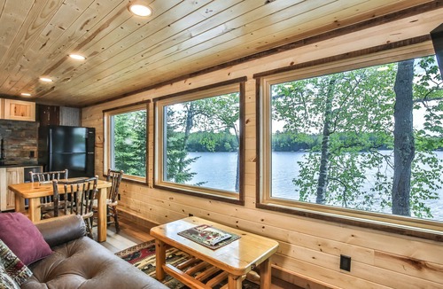 St Germain House | Remodeled lakeside resort cabin with fireplace, sandy beach, dock, firepit!