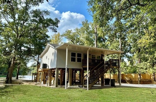 Modeste House | Secluded Riverside Oasis: Stunning Views, Private Dock, Beach Access & Adventure