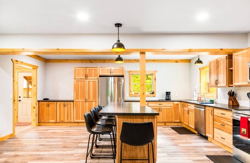 Presque Isle Cabin | Spacious lakefront lodge with fireplaces, WiFi, W/D, dock, & resort game room