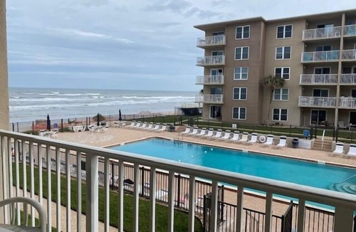 New Smyrna Beach Condo | Sunrise view over the ocean in this direct ocean front complex!