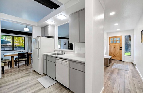 Graeagle Condo | This light-filled alpine retreat blends rustic charm with modern style.