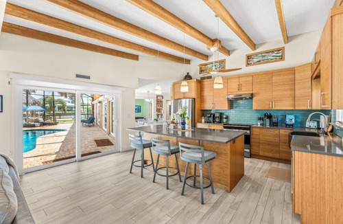 Cocoa Beach House | Tropical Riverfront Retreat w/Pool, Spa, Tiki Hut & Dock! 🌴