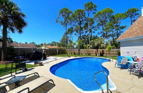 Myrtle Grove House | Very Private 3 Bed Home with HEATED Pool Palms and Big Fenced Yard