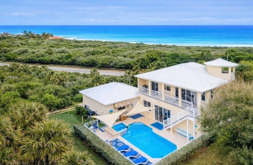 North Beach House | Walk to Beach Heated Pool + Hot Tub Private Putting Green Island Oasis