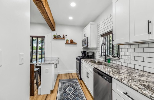 Holly Apartment | Walk to downtown Holly from this newly renovated historic apartment!