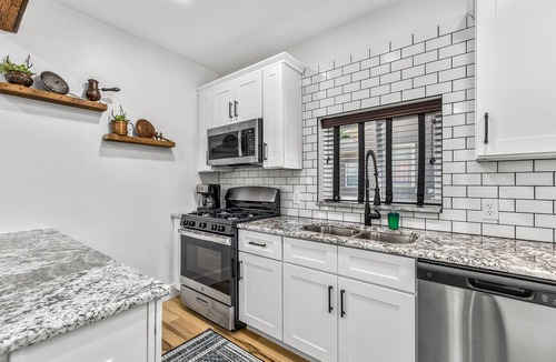 Holly Apartment | Walk to downtown Holly from this newly renovated historic apartment!