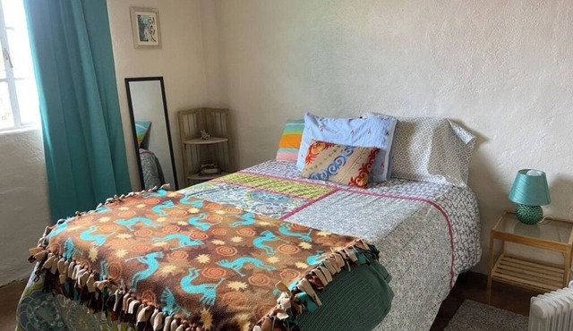 Colorful & cozy adobe perched up in Chihuahua Hill with great views!