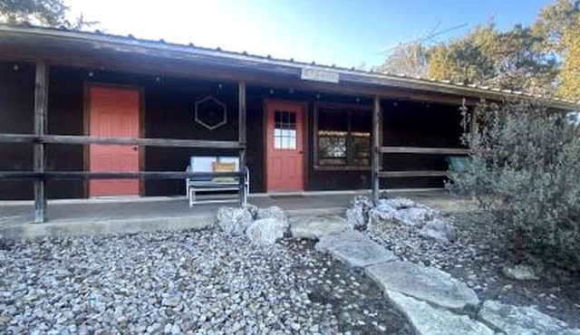Family Cabin Getaway with an Outdoor Fireplace near Lake Granbury in Texas