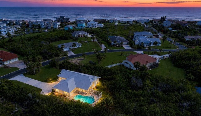 Lovely oceanside heated pool home with beach access a short stroll away!