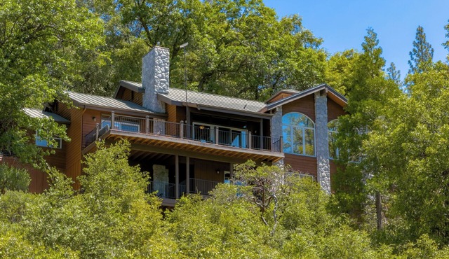 Majestic mountain lodge with private dock and shoreline