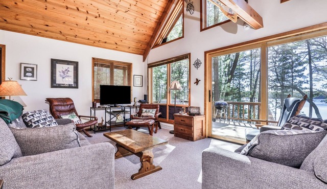 Private lakeside cabin on the shore of Virgin Lake with a large deck and firepit